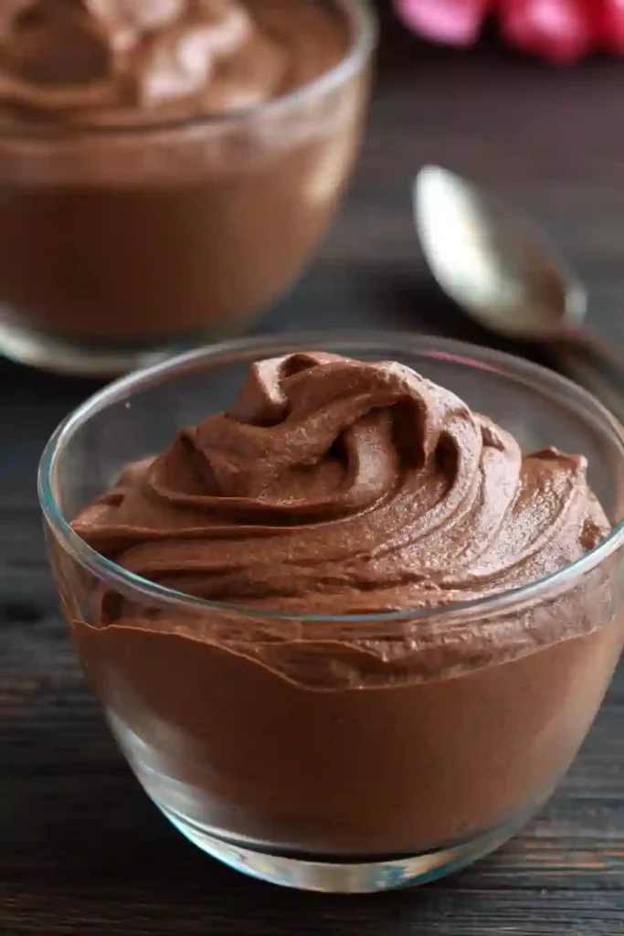 Healthy Chocolate Pudding 4 Creamy healthy chocolate pudding in a glass bowl with smooth texture and swirl peak