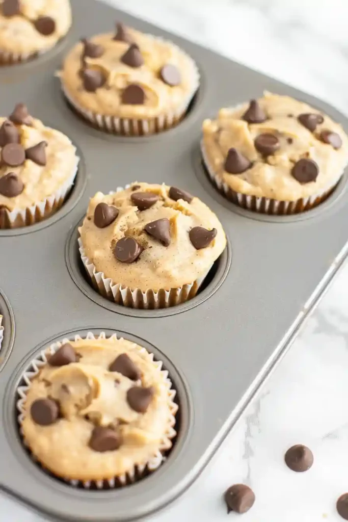 Healthy Banana Protein Muffins (Moist, Fluffy & High-Protein!) 3 Muffin batter scooped into liners before baking healthy banana protein muffins