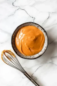 Crispy Healthy Chicken Nuggets (Air Fryer or Baked) 11 Creamy homemade dipping sauce being mixed for crispy chicken nuggets