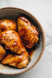 Hawaiian BBQ Chicken (High-Protein) 10 Raw chicken coated in Hawaiian BBQ marinade inside a rustic bowl with glossy tropical sauce