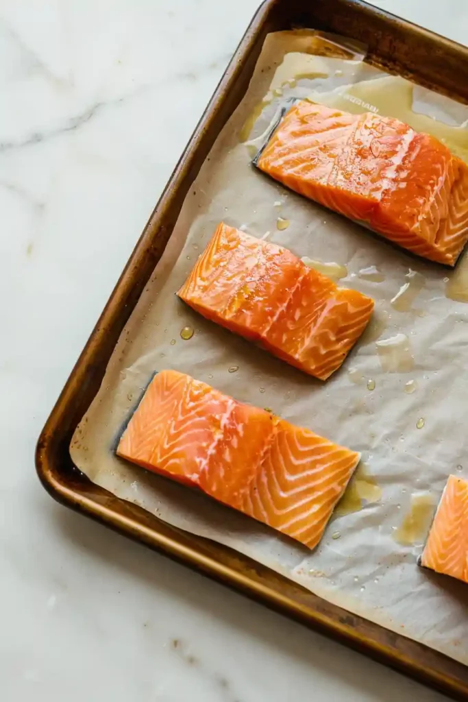 Healthy Sheet Pan Lemon-Herb Salmon with Asparagus Ready in 25 Min 3 Parchment-lined baking sheet prepared for lemon herb salmon recipe