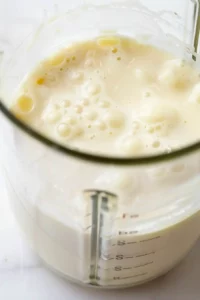 High-Protein Egg Bites for Meal Prep 4 Smooth blended egg and cottage cheese mixture inside a blender