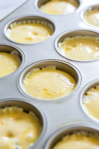 High-Protein Egg Bites for Meal Prep 6 Egg mixture poured into muffin tin ready to bake into cottage cheese egg bites