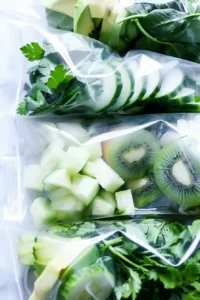 Green Protein Smoothie Bowl with Tropical Fruit 6 Prepared smoothie freezer bags filled with green fruits and vegetables ready to freeze overnight.