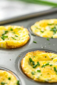 High-Protein Egg Bites for Meal Prep 7 Freshly baked cottage cheese egg bites cooling in muffin tin after baking